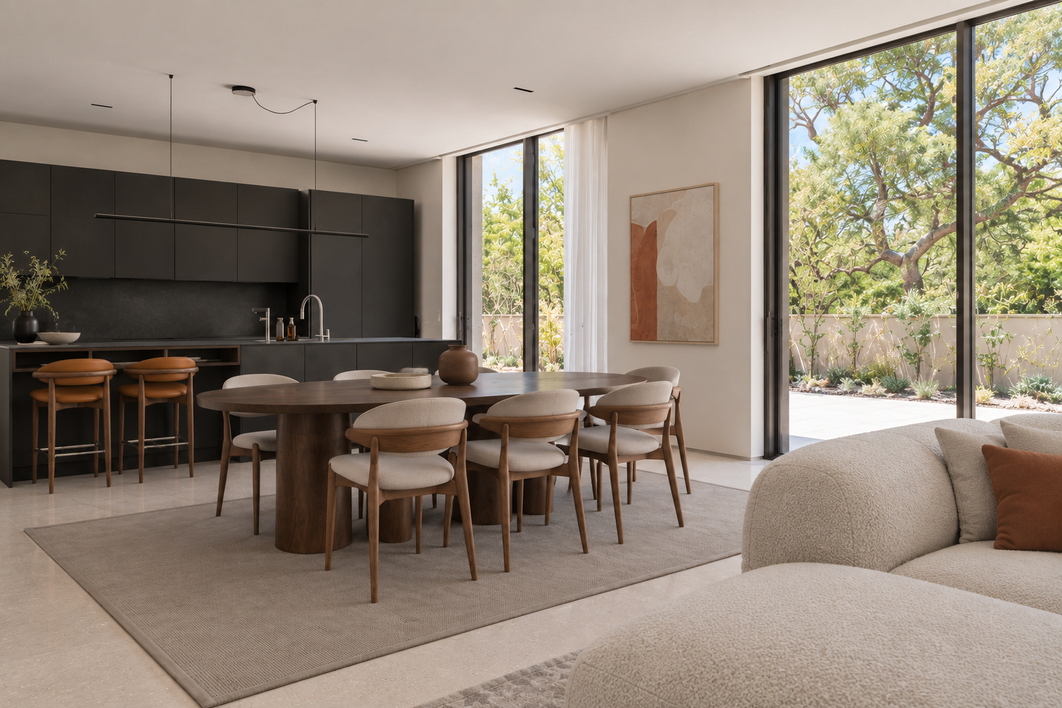 A naturally lit dining and kitchen space adjoining a living area.